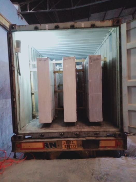 Large format slabs loaded upright inside a container
