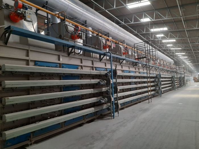 Multi-level dryer for freshly pressed tiles