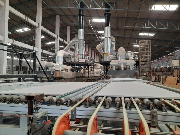 Conveyor line moving tiles through the plant